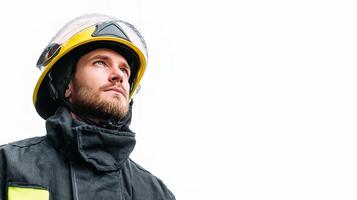 A man in a fireman's uniform is looking up photo