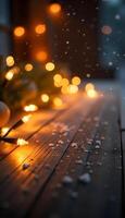 Christmas lights on a wooden table with snow falling photo