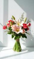 A bouquet of pink and white flowers in a vase photo