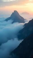 A mountain range is seen in the distance with clouds above photo