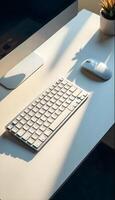 A white keyboard and mouse on a desk photo