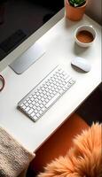 A desk with a keyboard, mouse, and a mug of coffee photo