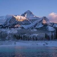 A mountain range is seen in the distance photo