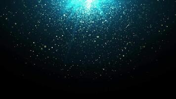 Abstract golden particles animation concept for birthday and holiday celebration on iconic blue background. 4k bokeh background with light particles falling like rain. Animated looping frames video