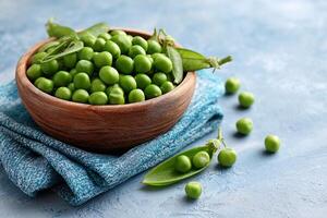 tempting peas in the rustic corner on a pastel blue background, in a clean food photography style photo