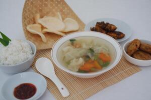 a traditional Indonesian meal served in a well organized and appetizing presentation photo