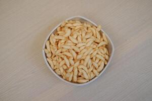 The snacks have a crunchy appearance and are uniformly shaped photo