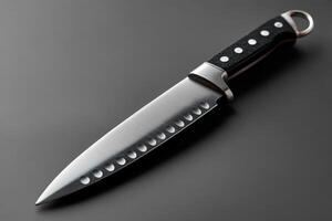 High-quality kitchen knife displayed on a dark surface with a sleek design and sharp blade photo