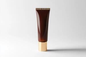 Cosmetic tube with gold cap isolated on white background with clean detail and minimalistic aesthetic photo