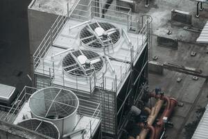 An overhead view of a building with several air conditioning units photo