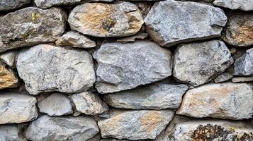 A detailed close-up of a stone wall constructed with natural stone photo