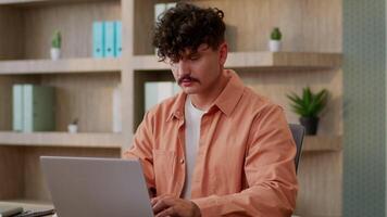 Computer work in office studying programming male businessman guy entrepreneur working online laptop chatting email browsing internet architect designer business man executive manager pc e-commerce video