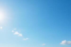 Azure Sky Background. A serene expanse of clear blue sky, punctuated by minimal wispy white clouds and the radiant glow of the sun. Perfect for backgrounds, adding a touch of calmness and optimism. vector