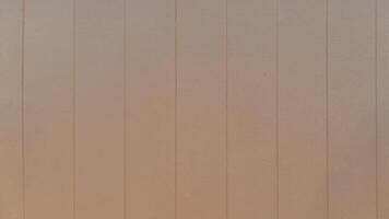 Pattern of brown artificial wood panels arranged vertically. For background and textured. photo