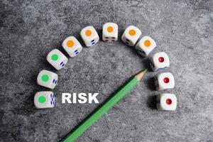 Risk level meter indicating high level of risk on dice photo