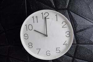 Focus time in clock of ten o'clock for design in your business concept isolated on black background photo