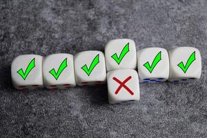 To correct a mistake. Recognize the error and correct the mistake. fixing the problems on wooden cubes or dice photo