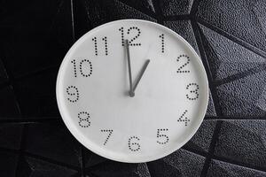 Focus time in clock of one o'clock for design in your business concept isolated on black background photo