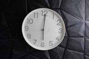 Focus time in clock of six o'clock for design in your business concept isolated on black background photo