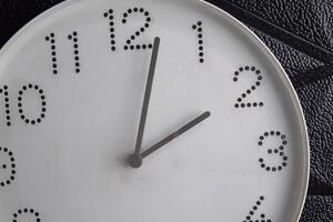 Focus time in clock of two o'clock for design in your business concept isolated on black photo