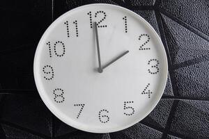 Focus time in clock of two o'clock for design in your business concept isolated on black background.. photo
