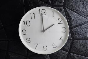 time in clock of two o'clock for design in your business concept isolated on black background photo