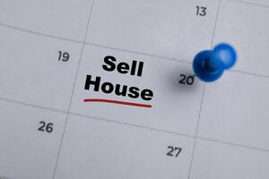 20th day of the month. Writing text Sell House on calendar date. Save the date. Day of the year concept. photo