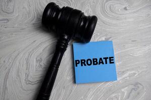 Concept of Probate write on sticky notes isolated on Wooden Table. photo