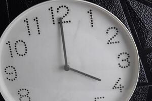 Focus time in clock of four o'clock for design in your business concept isolated on black background. photo