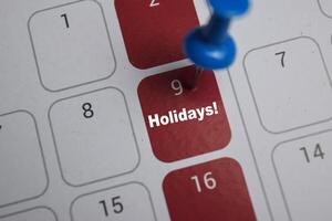 9th day of the month. writing text Holidays on calendar date. Save the date. Day of the year concept. photo
