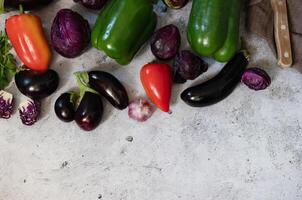 A variety of green peppers, cabbage and eggplant on the background of the old texture. Diet. Healthy eating theme background. View from above photo