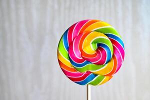Multicolored lollipop on a light background.Candy rainbow. photo