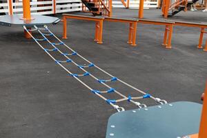 Children Playground with Climbing Swings, Climbers. Empty Wooden Playground made of Eco Materials photo