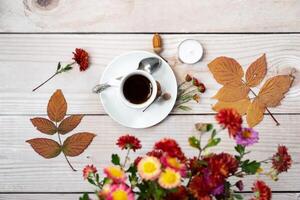 Festive autumn decor from pumpkins, a white wooden background. Concept of Thanksgiving day or Halloween. Flat lay autumn composition with copy space. photo
