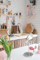 clean and light rustic kitchen with tulips photo