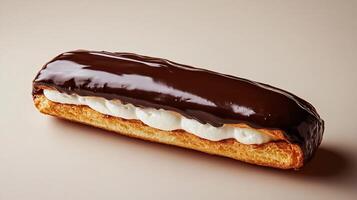 Exquisite Chocolate Eclair with Glossy Ganache Topping and Creamy Filling photo