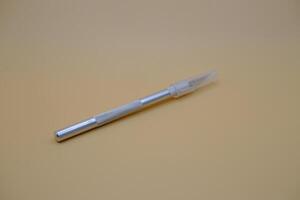 Utility Knife with Metal Handle and Transparent Cap photo