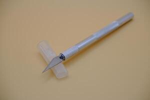 Precision Craft Knife with Safety Cap on Neutral Background photo