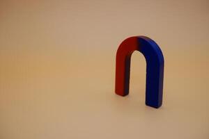 U Shaped Red and Blue Magnet on Neutral Background photo