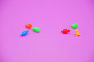 Assorted Tiny Dino Toys in Rainbow Colors photo