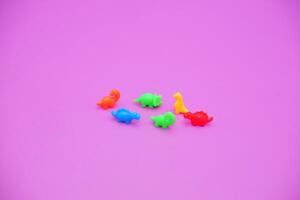 Cute Small Dinosaur Figures for Kids on Studio Backdrop photo