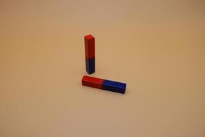 Pair of Bar Magnets on a Plain Background photo
