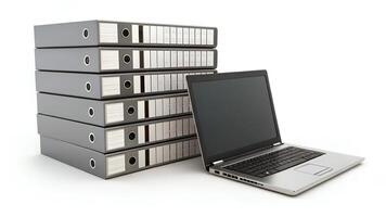 Stack of Ring Binders with Laptop on White Background photo