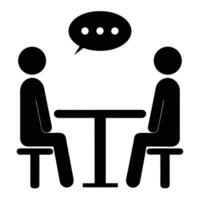 Two people sitting across a table discussing with speech bubble icon vector