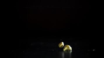 Pickled capers fall on the table. Filmed on a high-speed camera at 1000 fps. High quality FullHD footage video
