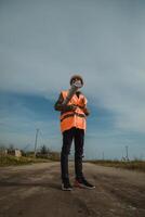 Architect Walking And Watching On The Construction Site With The Map In His Hands photo