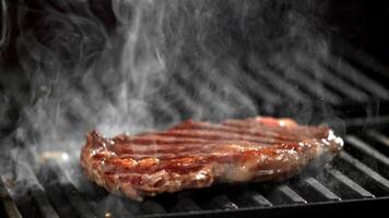 Beef ribeye steak is grilled. Filmed on a high-speed camera at 1000 fps. High quality FullHD footage video