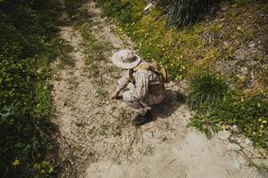 Mercenary Soldier Touching The Ground On A Mission photo