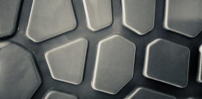 Abstract background geometric pattern in black and white .Closeup of a textured geometric pattern with hexagonal and polygonal shapes, creating a futuristic and modern black-and-white photo