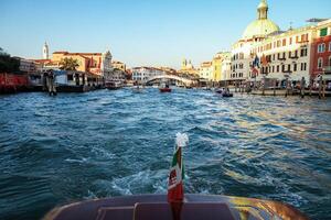 View of the Grand Canal from a boat in Venice, Italy. photo